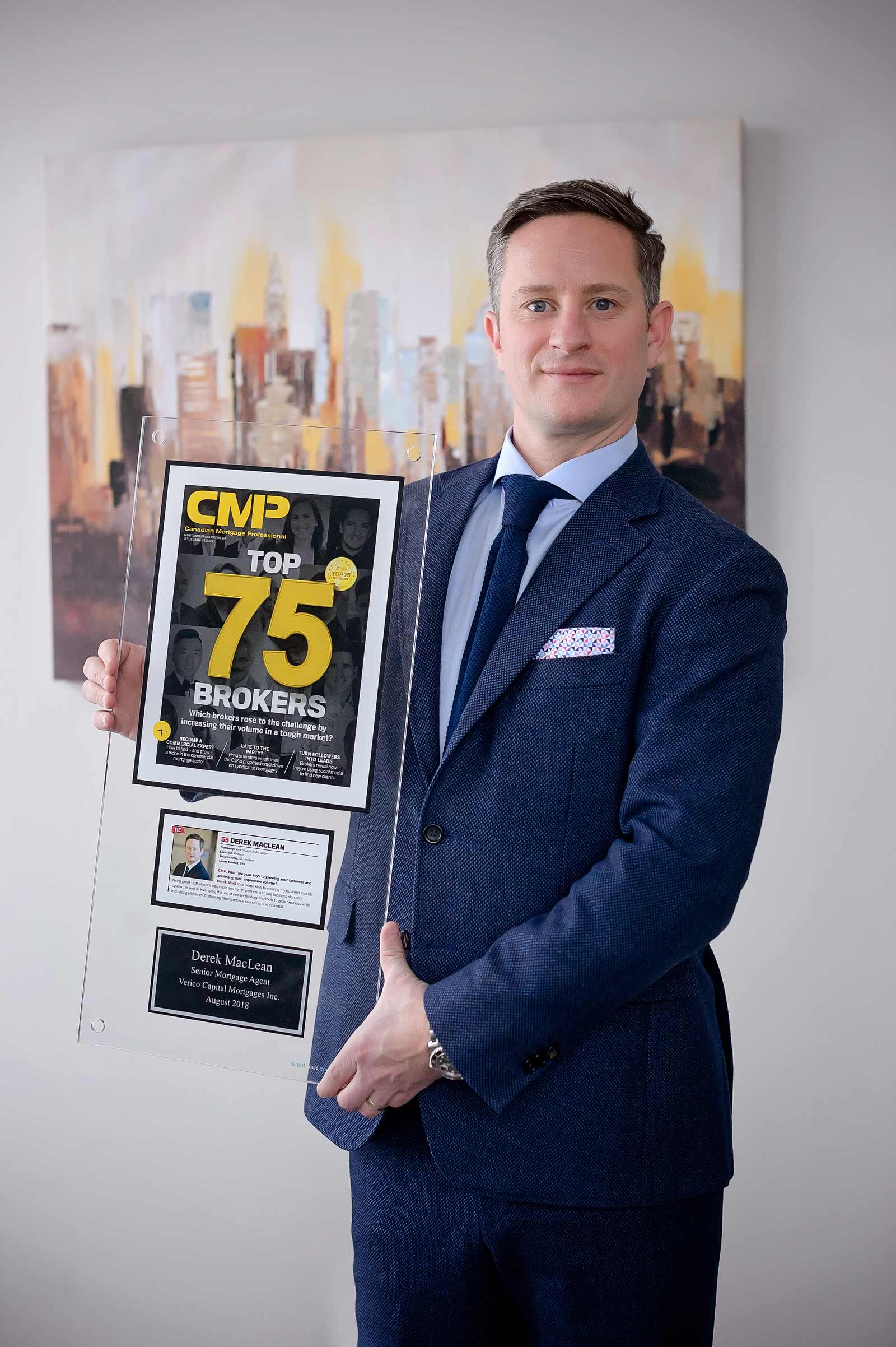 Derek MacLean with the MacLean Team at Capital Mortgages with his accolade of top 75 mortgage brokers in Canada